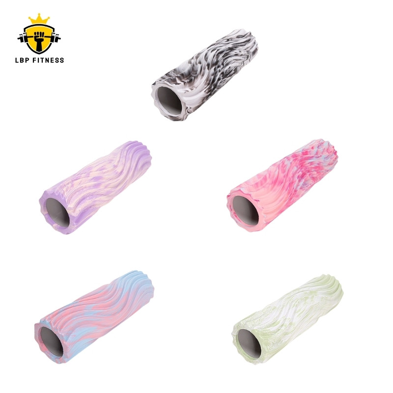 Hollow foam roller in varied color patterns