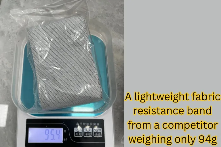 A lightweight fabric resistance band from a competitor weighing only 94g, indicating thin material and low-density weave prone to lose elasticity sooner.