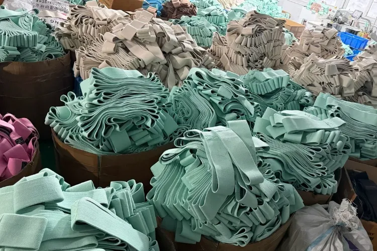 LBP Fitness factory workshop producing bulk custom fabric band loops in mint green and other colors for wholesale